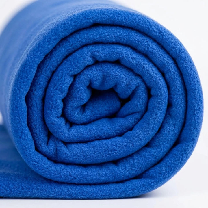 Envelope style green lightweight sleeping bag liner, ideal for camping, hiking, and adventure gear.