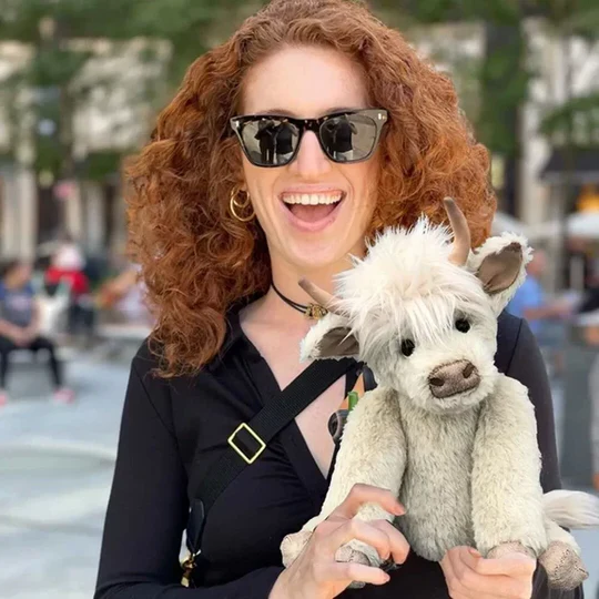Cute handmade Scottish Highland cow cuddly toy, plush farm animal with shaggy fur, unique Scottish gift.
