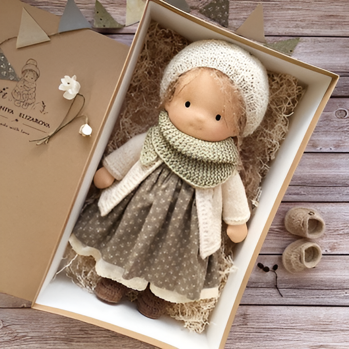 Handmade Waldorf cloth doll with simple features, encouraging child's creativity.