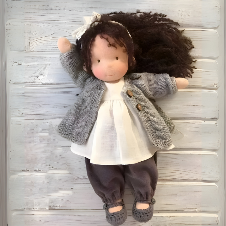 Ethical Waldorf doll, a cherished heirloom cloth toy promoting imaginative play.