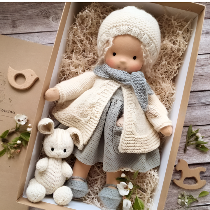 Natural fiber Waldorf doll, a soft handmade cloth toy for gentle imaginative play.