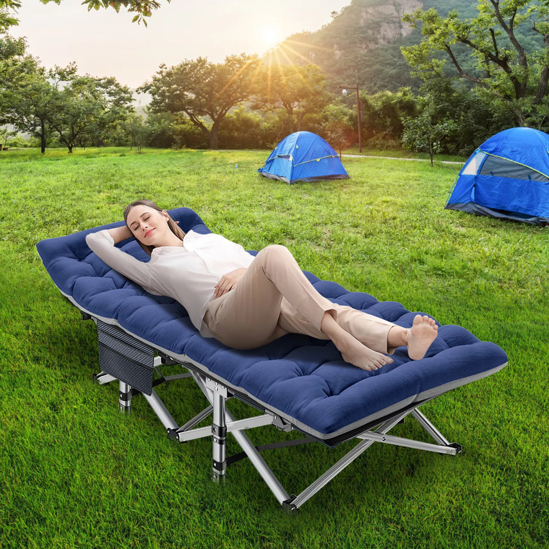 Folding camping cot open, showcasing its sturdy build and included mattress.