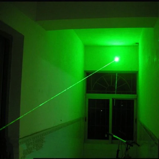 High-power green laser pointer, ideal for hunting, stargazing, and outdoor adventure; bright beam.