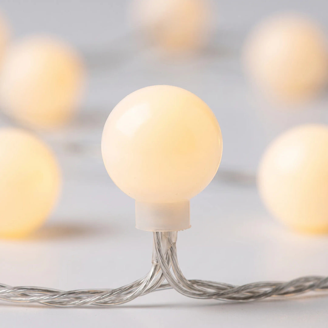Cozy ambient lighting with LED globe string lights. Perfect for bedroom decor, patio, or special events.