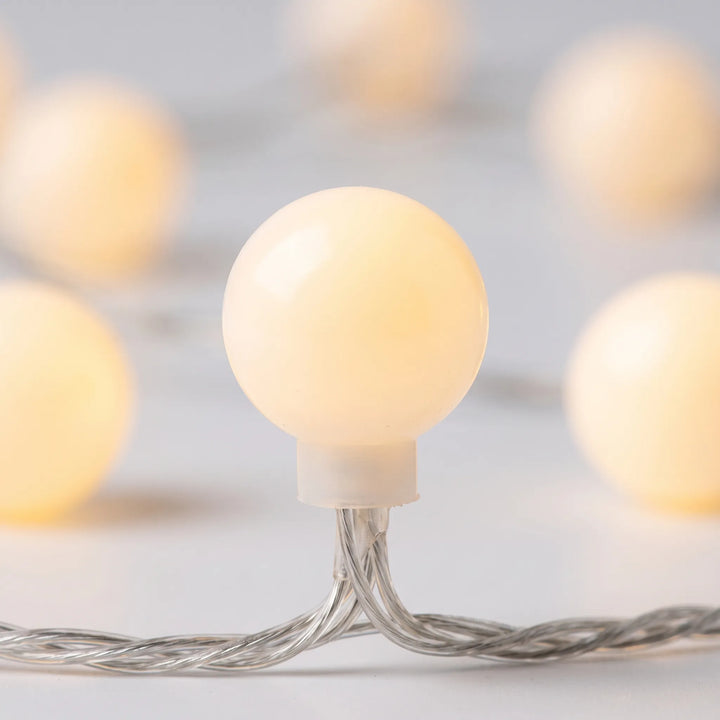Cozy ambient lighting with LED globe string lights. Perfect for bedroom decor, patio, or special events.