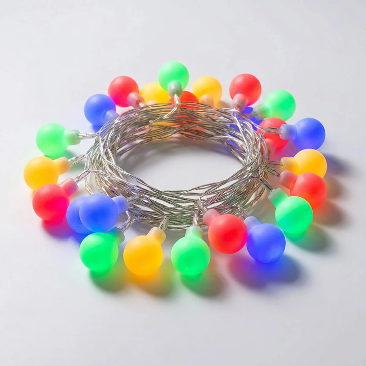 Decorative LED globe string lights creating a warm glow. Ideal for room decor, garden, or party ambiance.