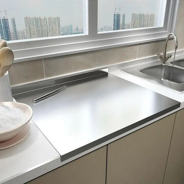 Hygienic stainless steel cutting board with non-slip grip, perfect for professional kitchen food prep. Durable & dishwasher safe.