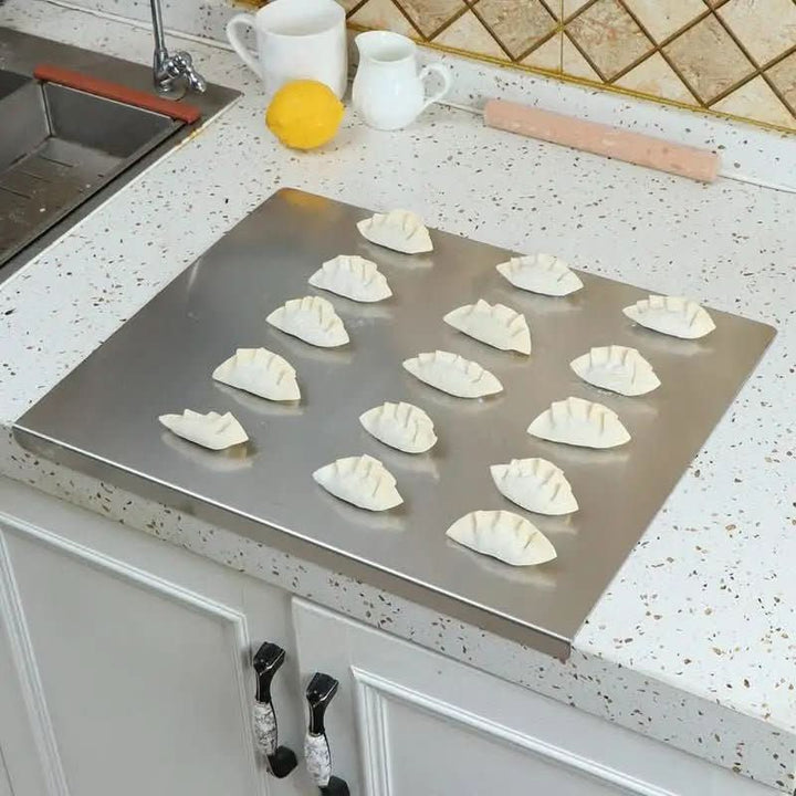 Sleek stainless steel cutting board with non-slip grip. Ideal for culinary food prep, durable & easy to clean in dishwasher.