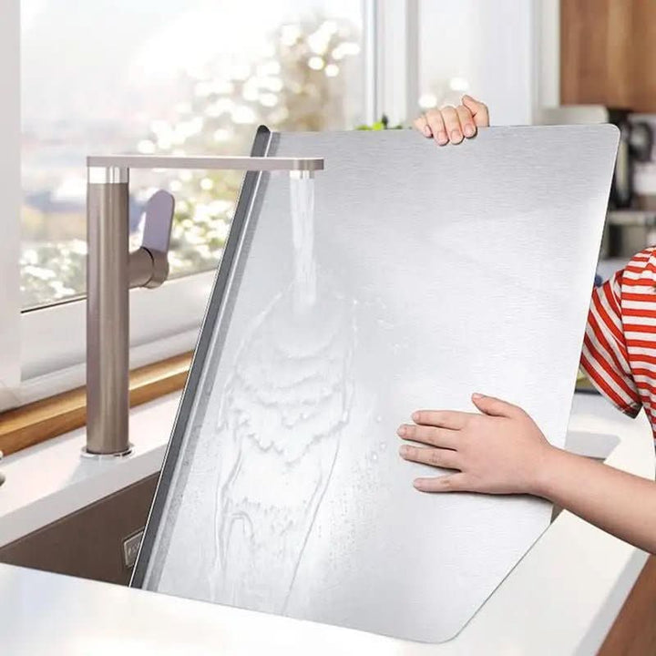 Unisex stainless steel cutting board, hygienic & durable for any kitchen. Features a non-slip grip for safe food prep.