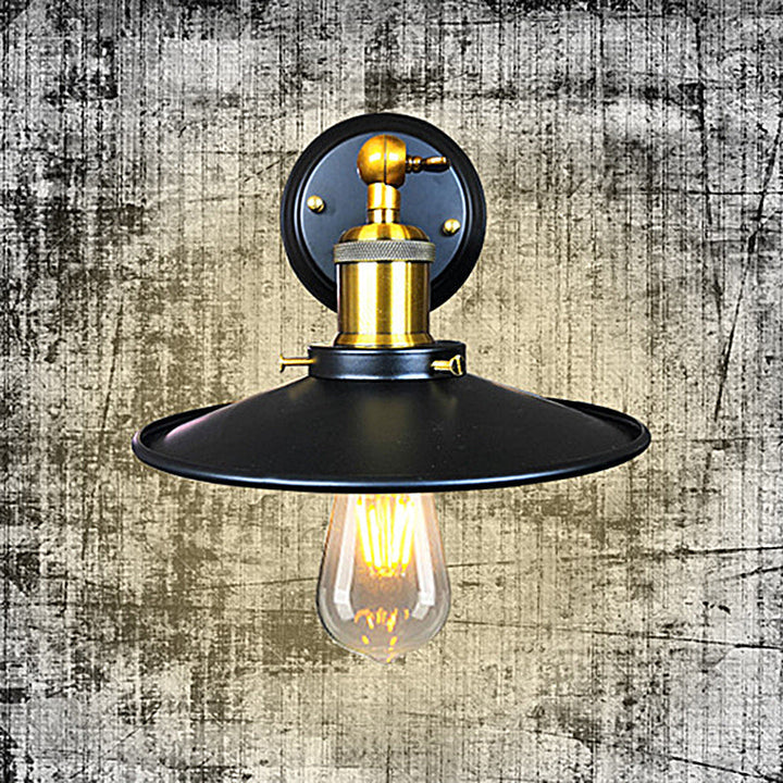 Rustic industrial wall sconce with vintage appeal. Metal accent light for home decor, perfect for farmhouse interior lighting.