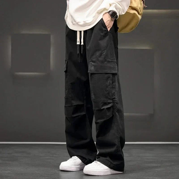 Khaki men's relaxed fit utility cargo pants with drawstring waist & multi-pockets for casual everyday wear.