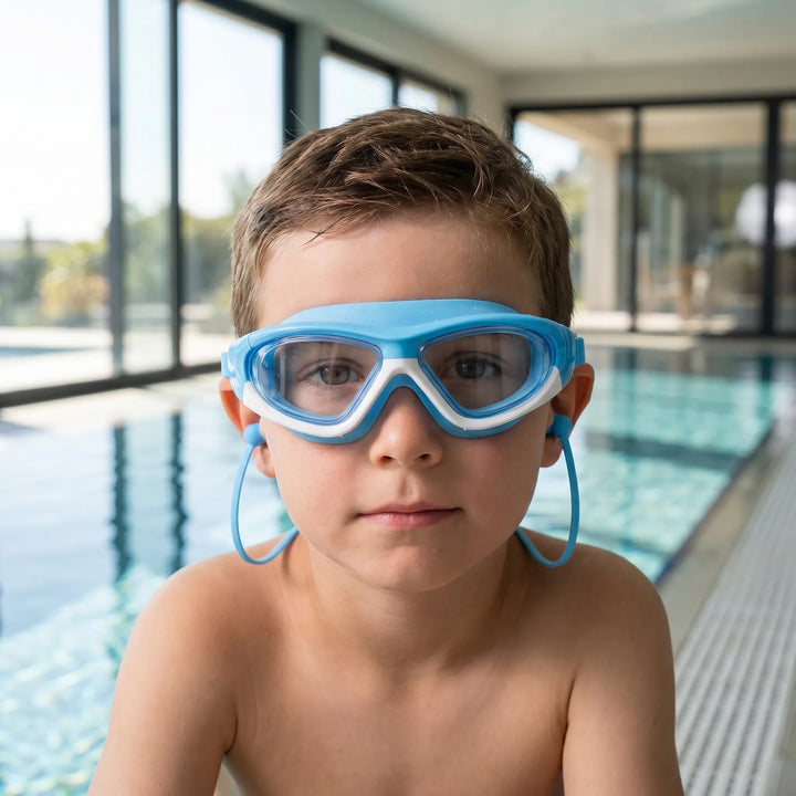 Kids' anti-fog swim goggles with UV protection, adjustable strap for a secure and comfortable fit, perfect for swimming.