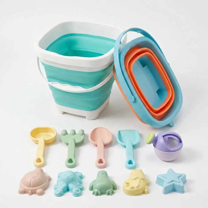 Colorful kids' beach toy set with collapsible bucket, shovel, & sand molds for creative outdoor play.