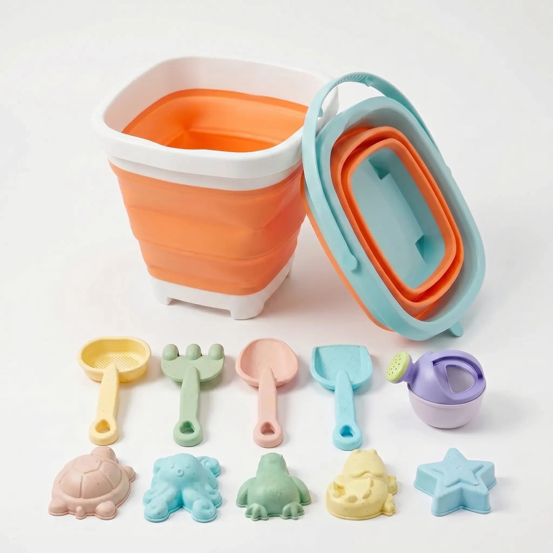 Complete kids' collapsible beach toy set displayed with bucket, shovel, rake & sand molds for play.