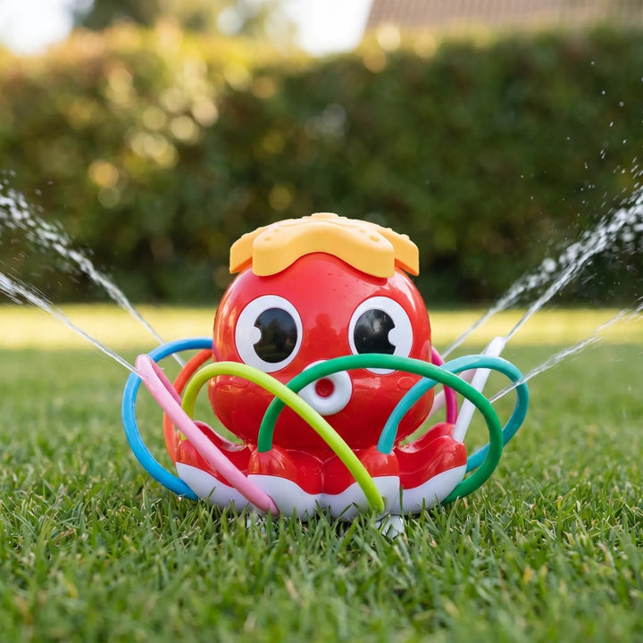 Children laughing and playing with a vibrant octopus water sprinkler in a sunny garden, perfect for summer family fun.