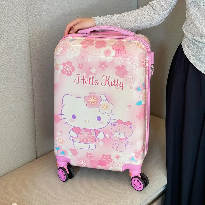 Adorable Hello Kitty & Kuromi design on kids' wheeled hardshell suitcase with included organizer bag.