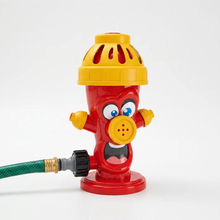 Colorful spinning water sprinkler for children's outdoor fun, splashing water in a garden for summer playtime.