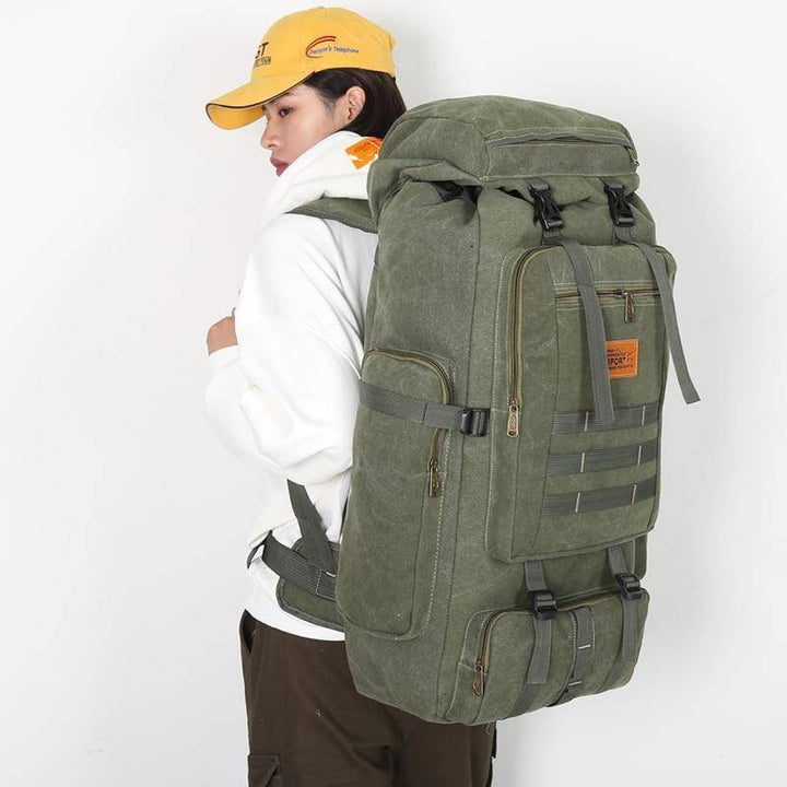 Military-style 80L travel backpack with multiple compartments, perfect for long hiking trips.