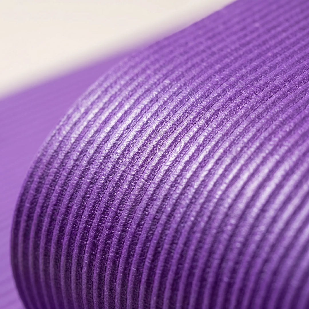Comfortable, large, thick workout mat for home gym. Non-slip design for yoga, pilates, and floor exercises.