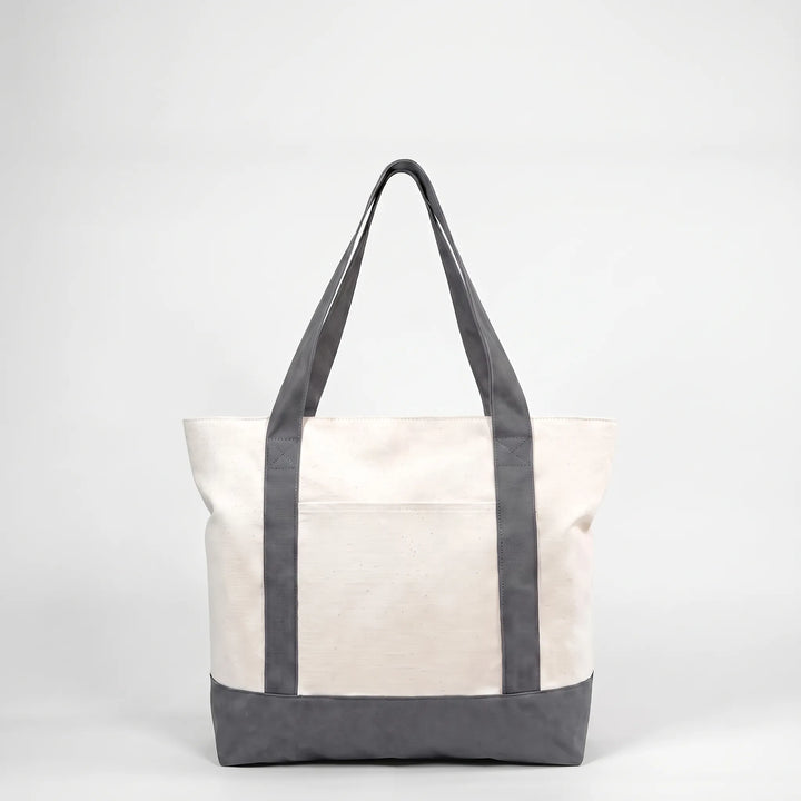 Spacious unisex tote bag with secure zipper, ideal for shopping, commuting, or travel.