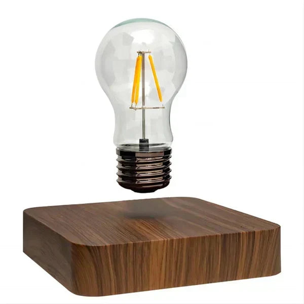 Innovative floating light bulb, LevitaLux magnetic lamp with a warm walnut wood base, ideal ambient desk lighting.