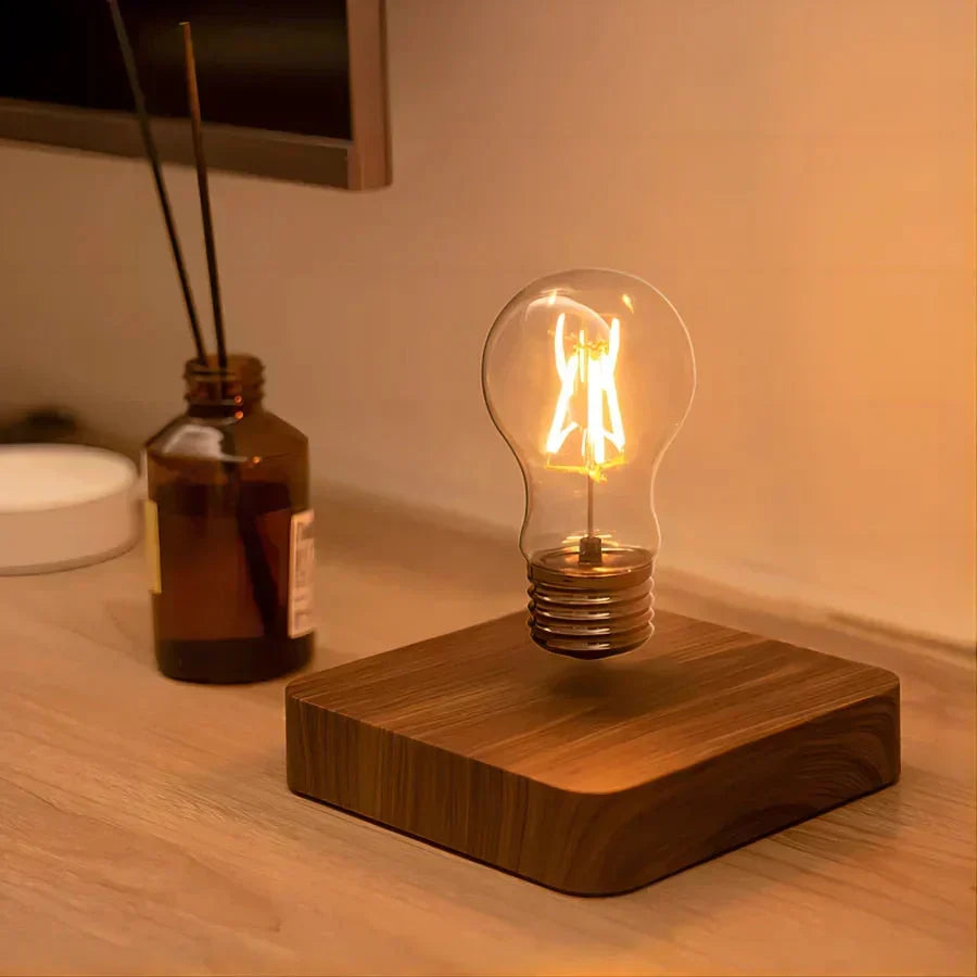 Stylish levitating lamp, a unique gift featuring an Edison bulb floating above a rich walnut wood base.