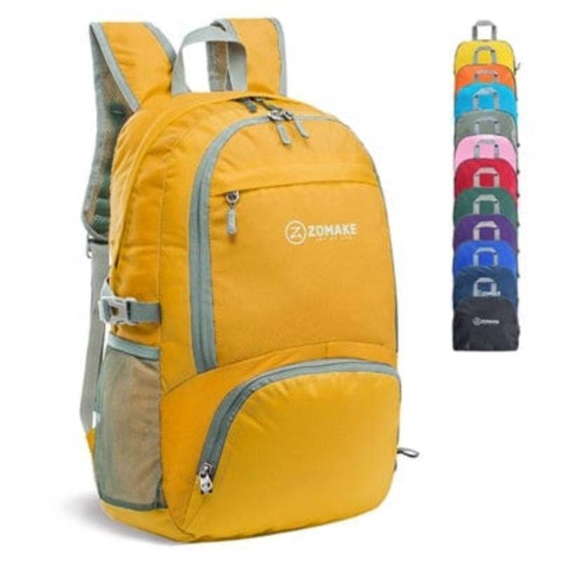 Detail of strong zippers and reinforced seams on a durable packable hiking backpack.