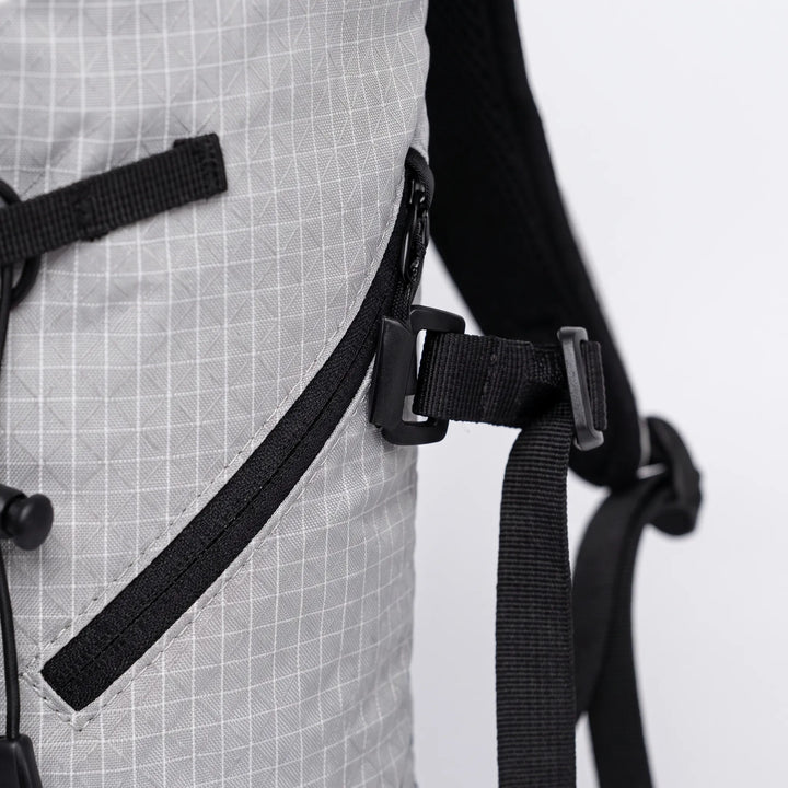 Ergonomic lightweight hiking pack with water bladder pocket, ideal for trail adventures & comfort.