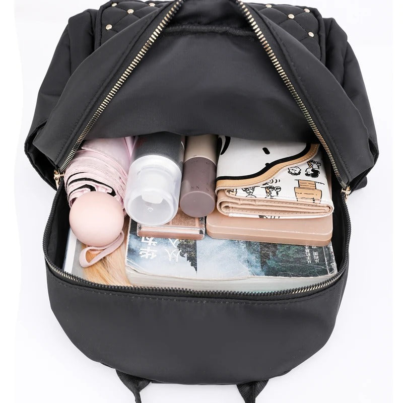Lightweight water-resistant school backpack for women, made from durable nylon for daily use.
