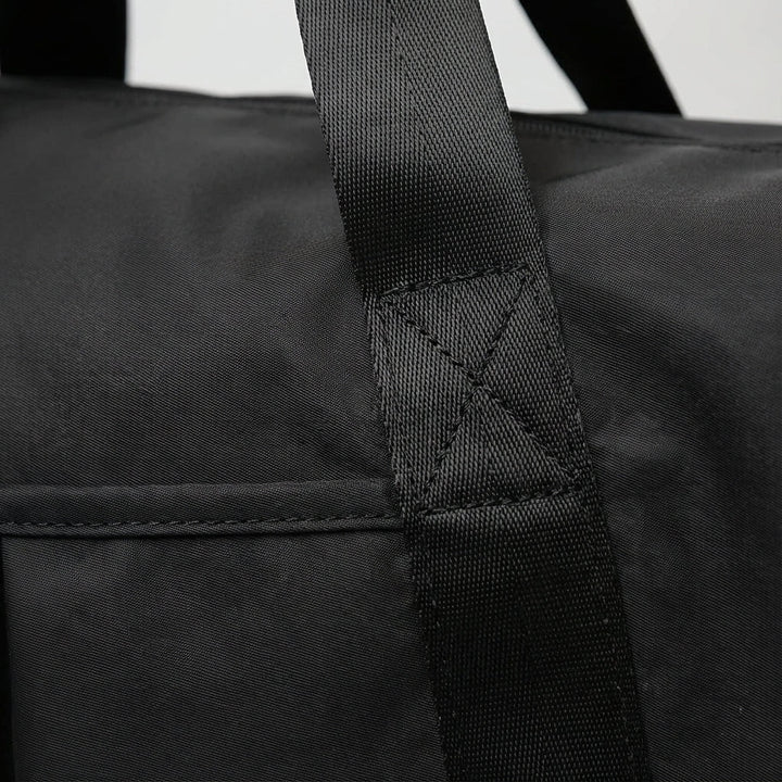 Durable lightweight waterproof unisex duffel bag for weekend trips. Perfect sports bag, gym bag, or carry-on.
