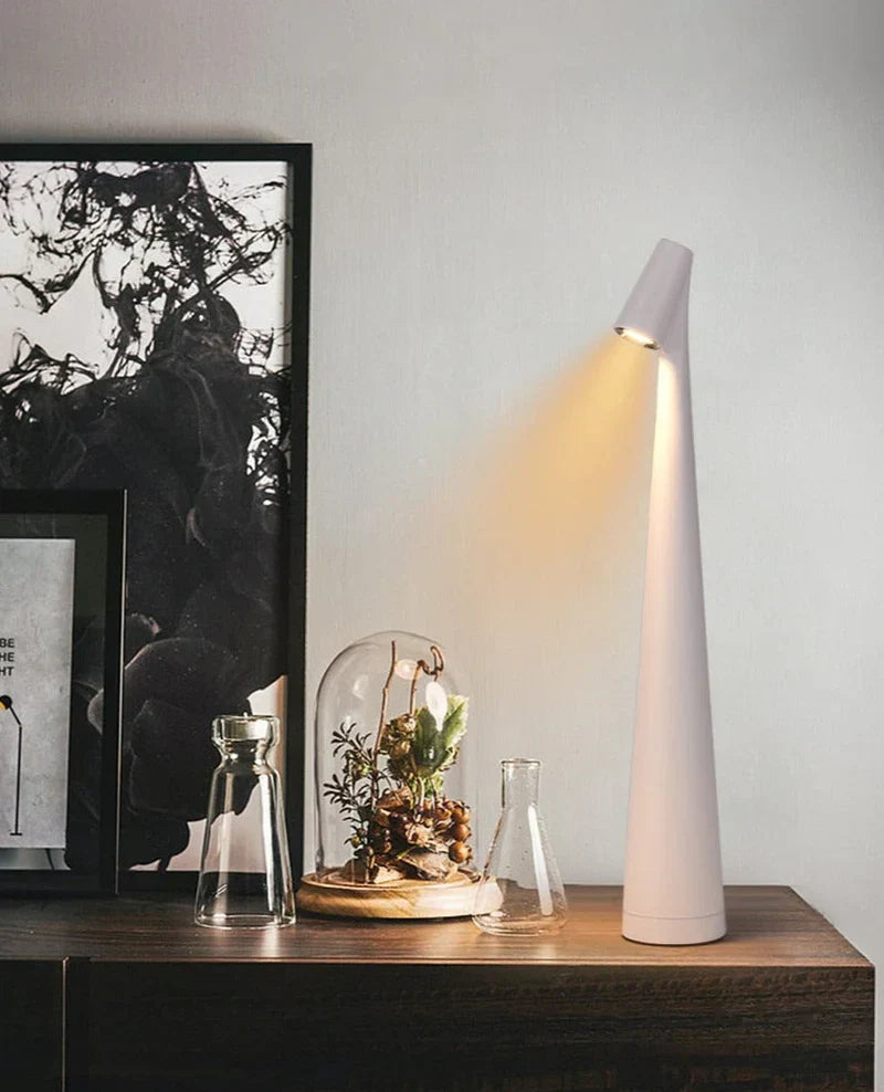 Black LunaLite wireless table lamp. Rechargeable LED portable light, perfect for modern home decor accent.