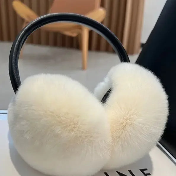 Elegant women's faux fur earmuffs, providing luxurious warmth & protection against winter cold. A fashion accessory.