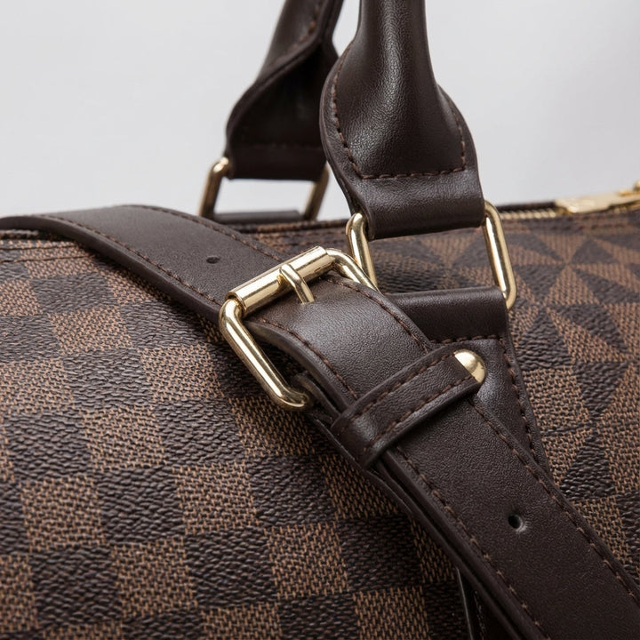 Elegant black leather duffel bag, a unisex luxury weekender for stylish travel. Perfect carry-on luggage.