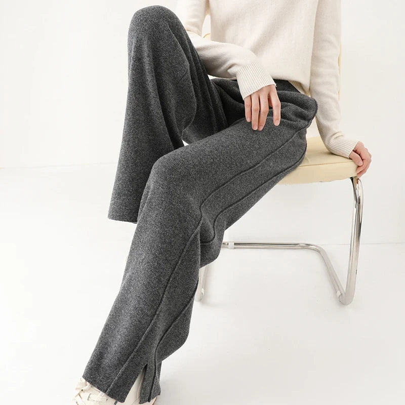 Close-up of the luxurious texture of women's merino wool trousers, highlighting softness and quality.