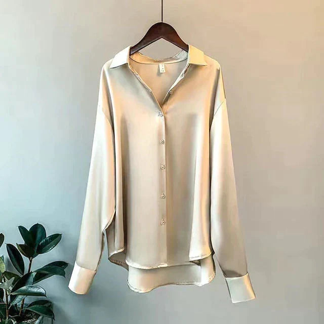 Luxurious women's relaxed fit button-up shirt. Elegant long sleeve blouse, perfect for versatile chic style.