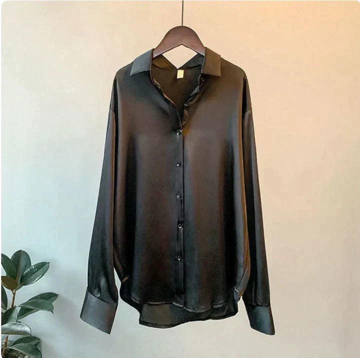 Classic women's relaxed fit button-up shirt. Luxurious long sleeve blouse for an elegant and chic modern look.