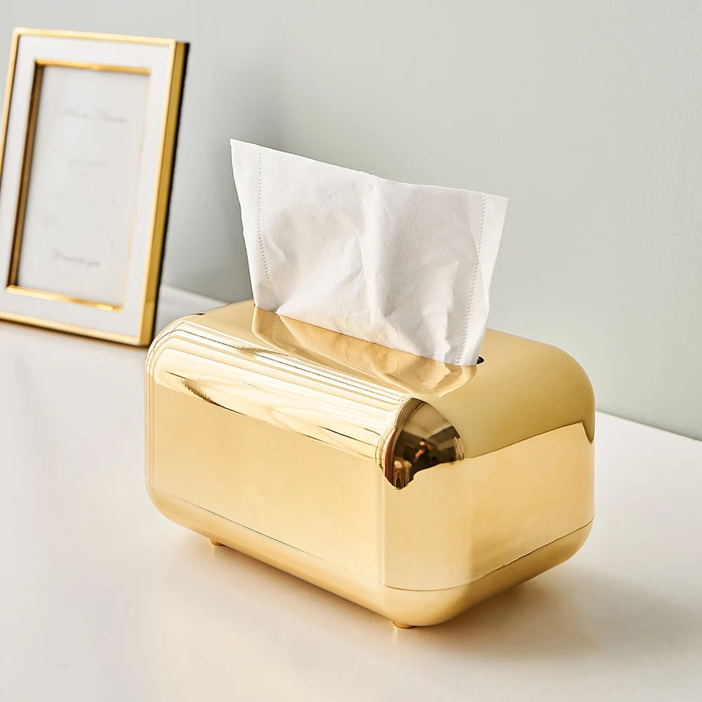 Premium luxury tissue dispenser in gold and silver, perfect for elegant home decor.