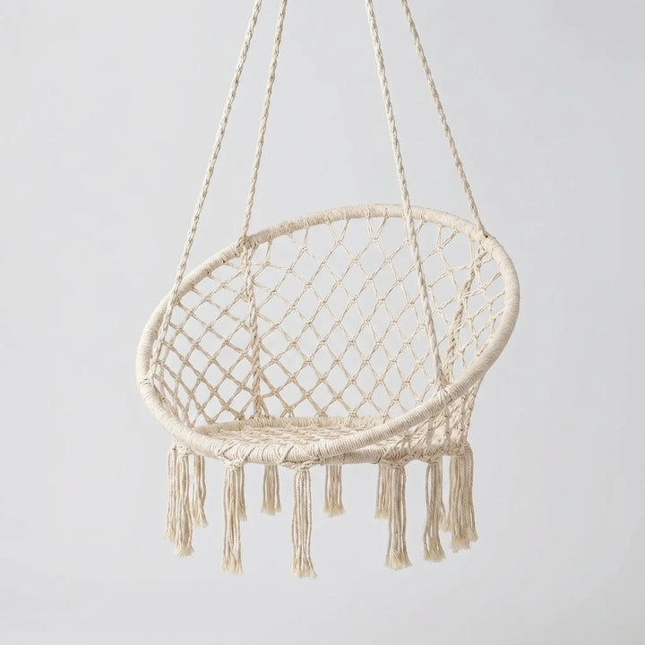 Comfortable Macrame Swing Chair. Hand-woven cotton for a cozy indoor accent or relaxing outdoor lounge.