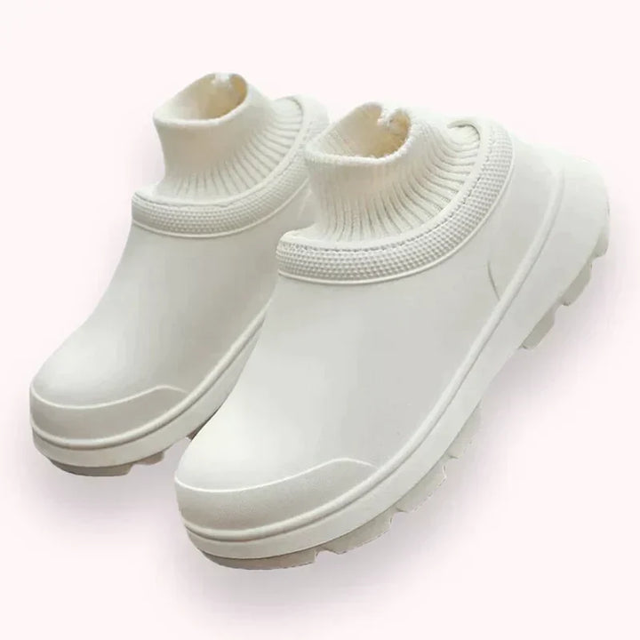 Comfortable Madeline slip-on clogs for women, featuring a cozy knit ankle cuff and waterproof design.