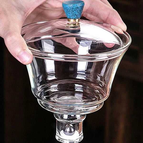 Modern magnetic glass tea set displayed on a tabletop, perfect for brewing and serving loose leaf tea with style.