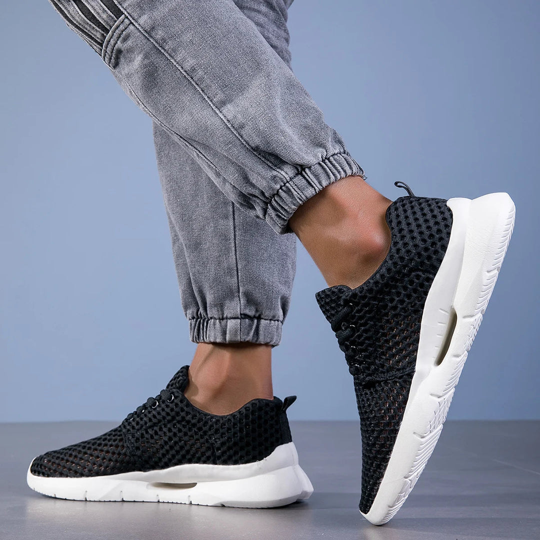 Innovative Aero Mesh men's athletic shoes, lightweight & breathable for peak running performance.