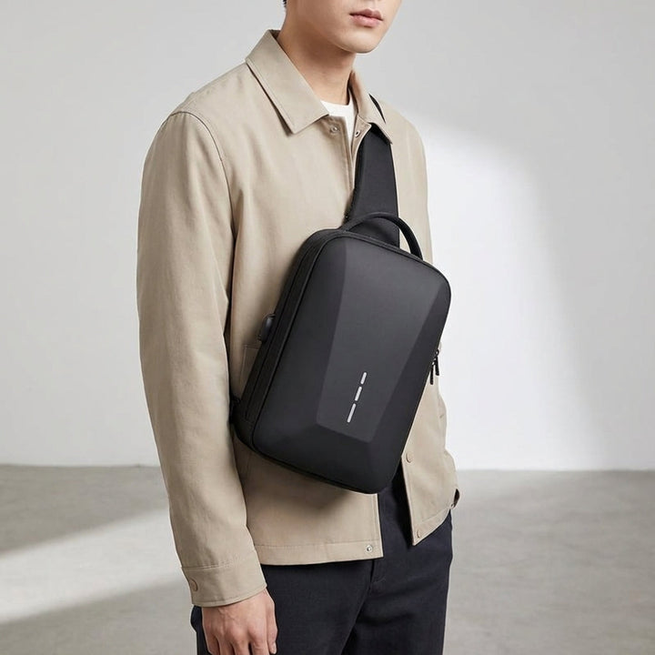 Stylish men's anti-theft messenger bag, water-resistant, with lock & USB charging for travel security.
