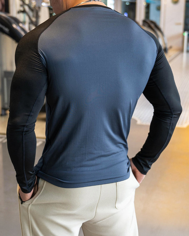Gym wear men's long sleeve top, comfortable and sculpted, with athletic shoulder cut.