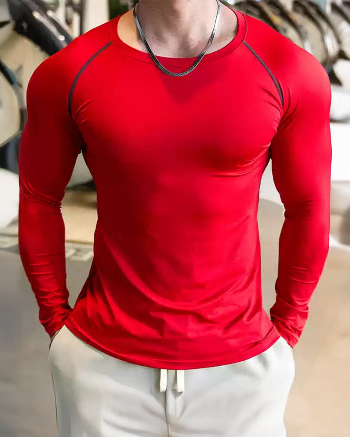 Athletic men's long sleeve gym top with a distinctive shoulder cut for modern style.