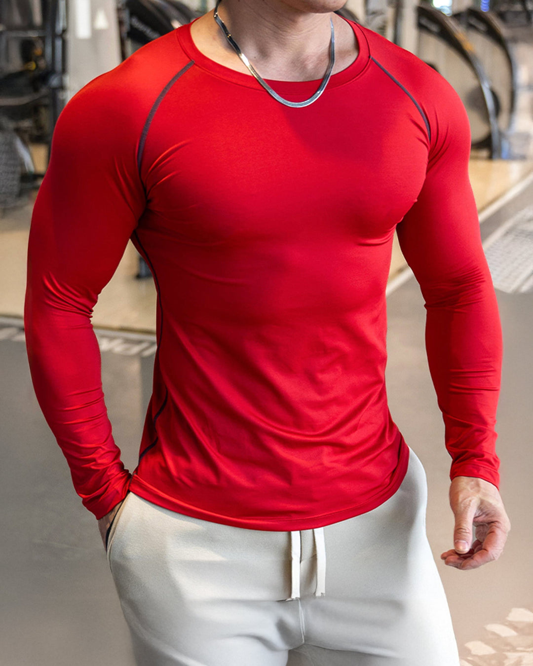 Men's long sleeve activewear top for gym, with performance-enhancing shoulder cut.