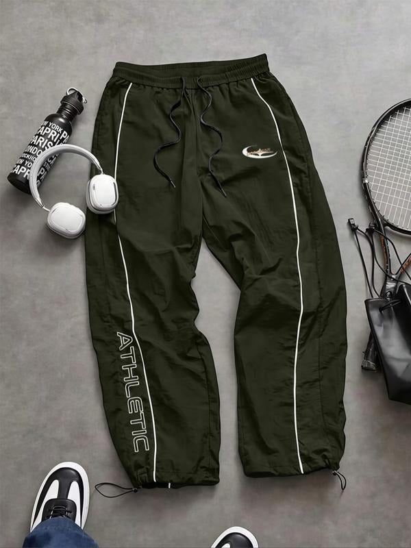 Men's activewear track pants with tapered fit. Sportswear designed for ultimate comfort & flexibility during workouts.