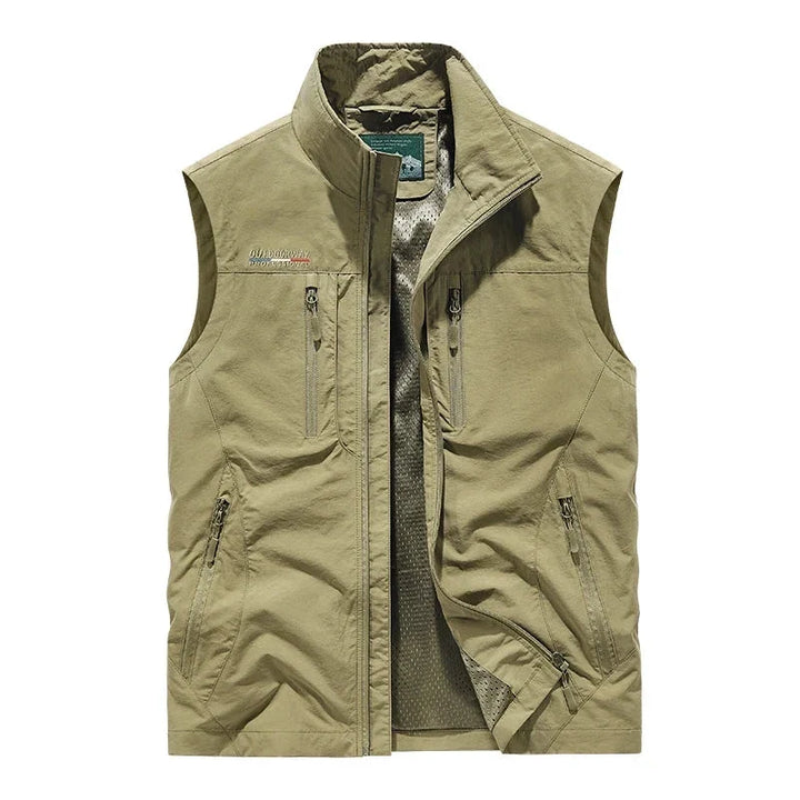 Breathable men's utility vest, lightweight for travel & hiking, with ample pockets for outdoor essentials.