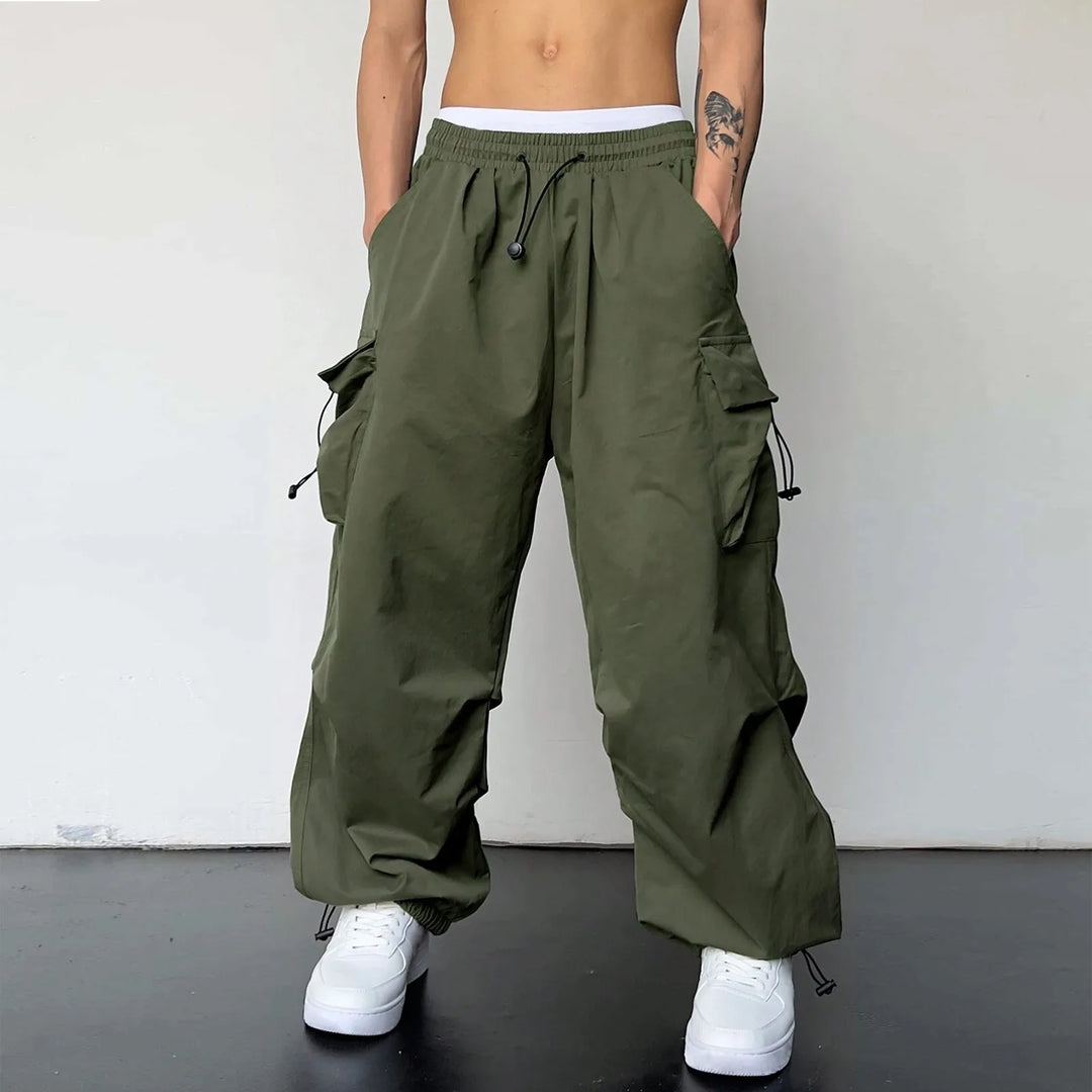 Stylish men's baggy fit cargo pants, showcasing parachute design for a trendy streetwear & casual look.