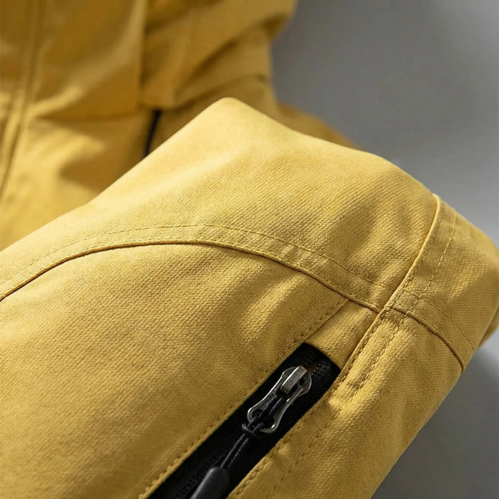 Stylish men's zip-up softshell jacket with a hood, offering wind protection & comfort for everyday wear.