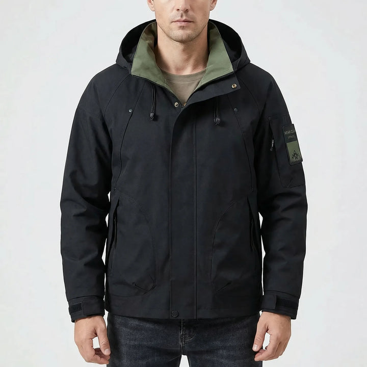 Durable men's hooded softshell windbreaker, water repellent, perfect for hiking and keeping warm outdoors.